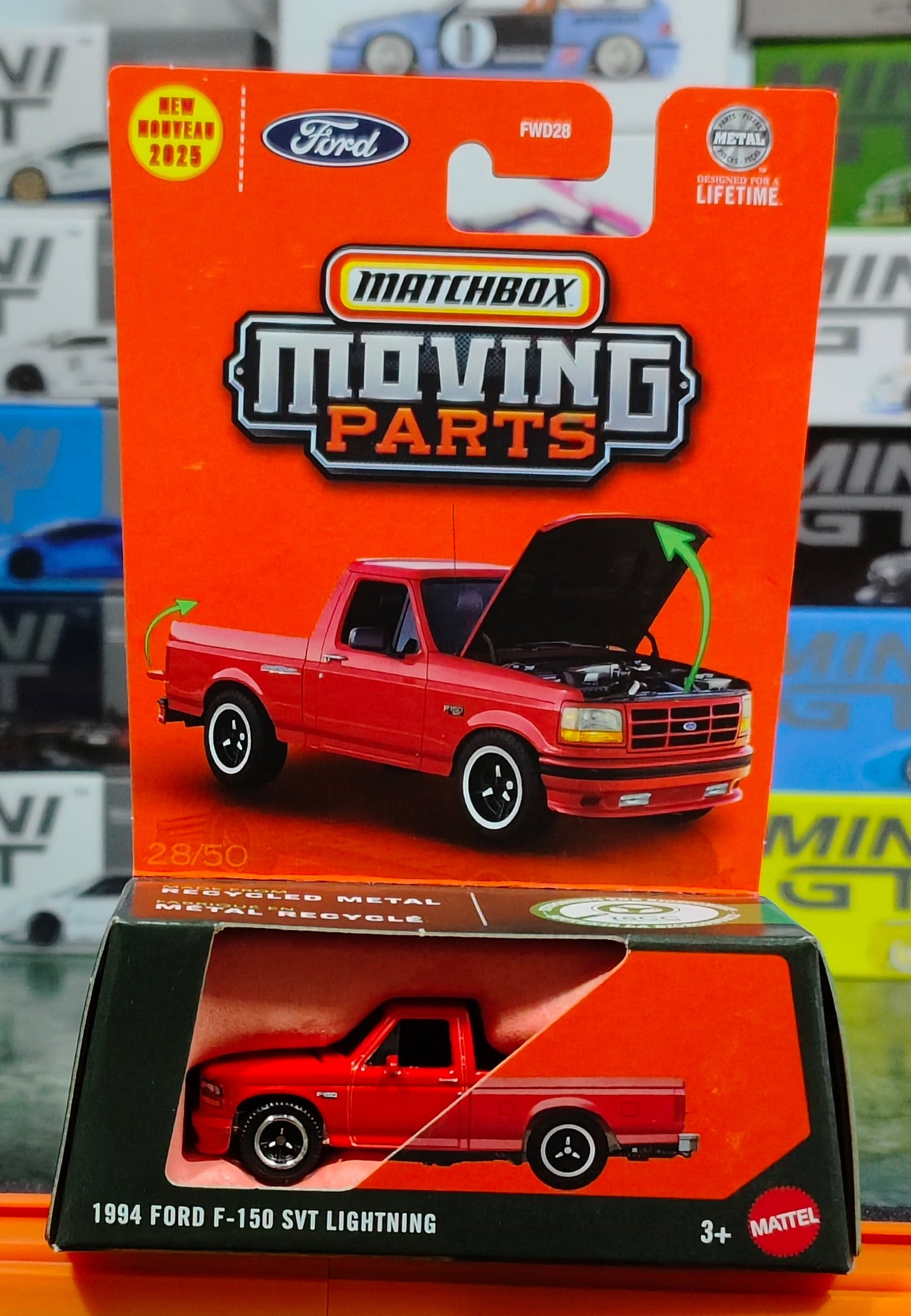 Matchbox toy truck packaging with a red truck on an orange background