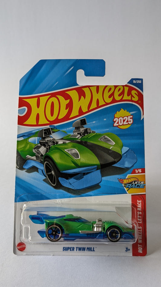 Hot Wheels green race car in packaging on a gray background