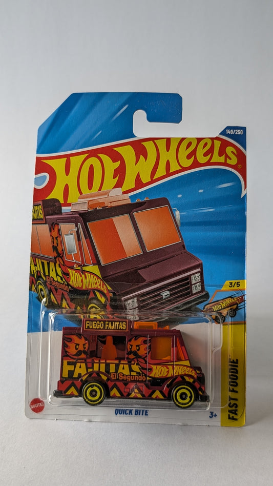Hot Wheels toy truck in packaging on a gray background