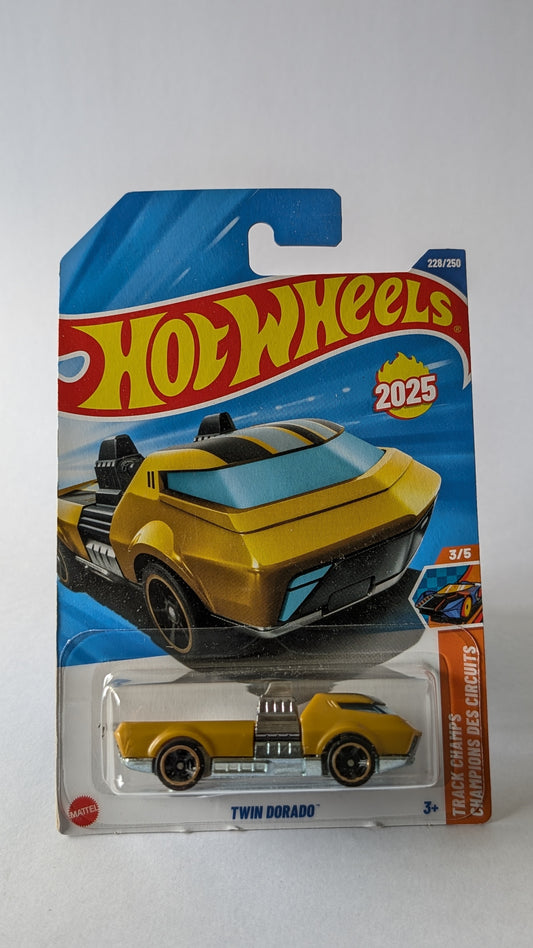 Hot Wheels Twin Dorado toy car in packaging on a white background