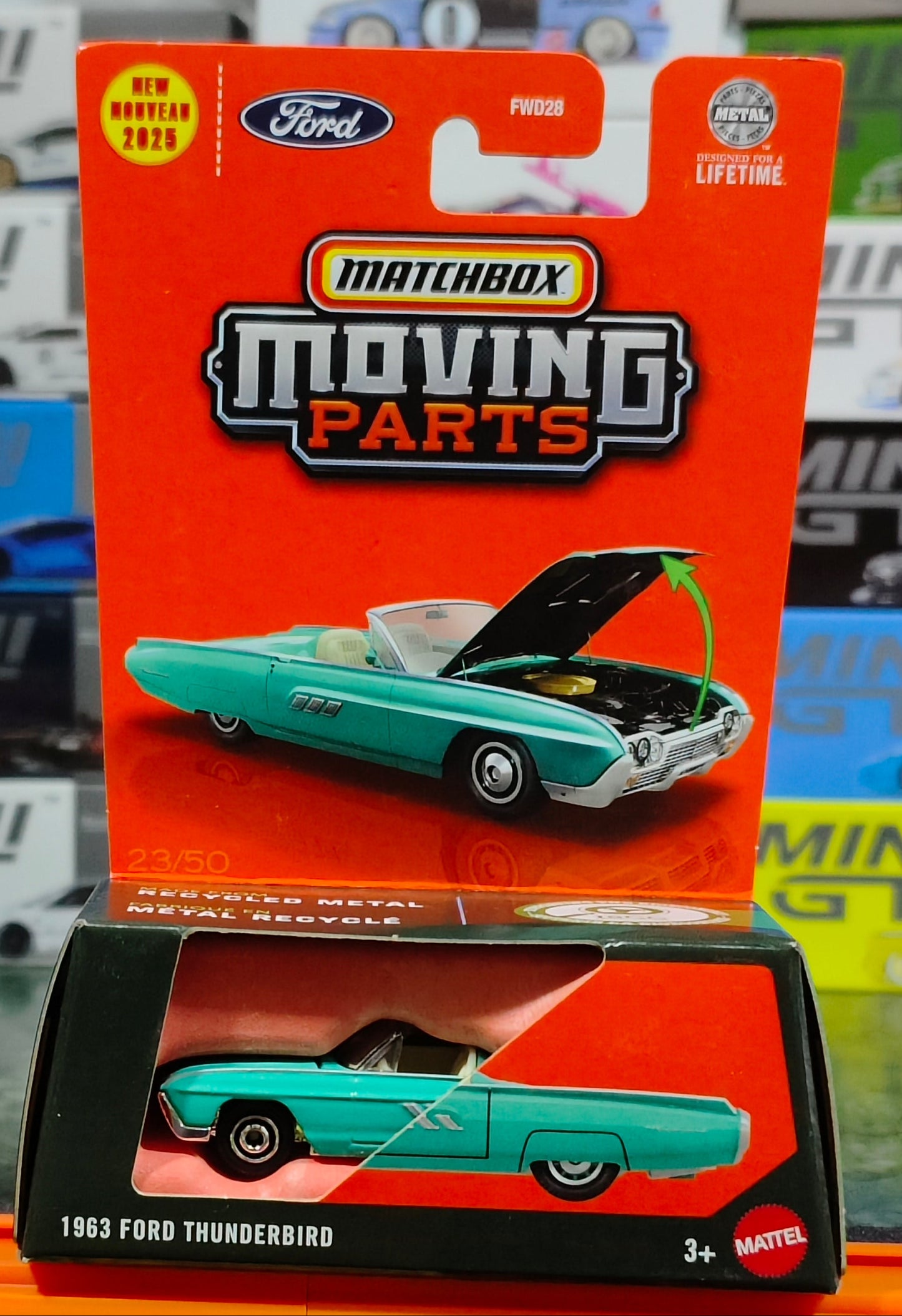 Matchbox 1963 Ford Thunderbird toy car with open hood on a display stand.