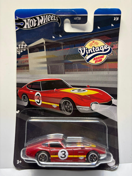 Hot Wheels vintage racing club car in packaging with race track background