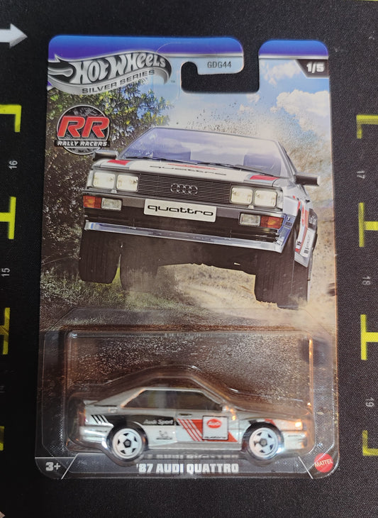 Hot Wheels '97 Audi Quattro model car in packaging on a black surface