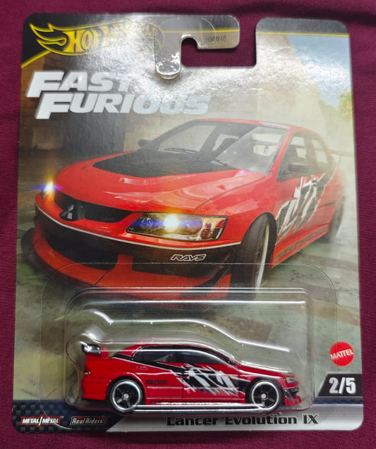 Hot Wheels Fast & Furious Lancer Evolution IX toy car in packaging on a purple background