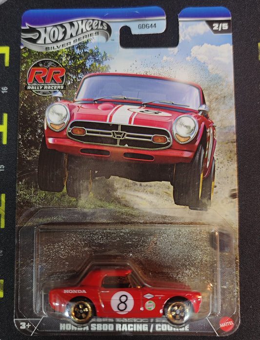 Hot Wheels Honda S800 Racing die-cast car in packaging on a black background