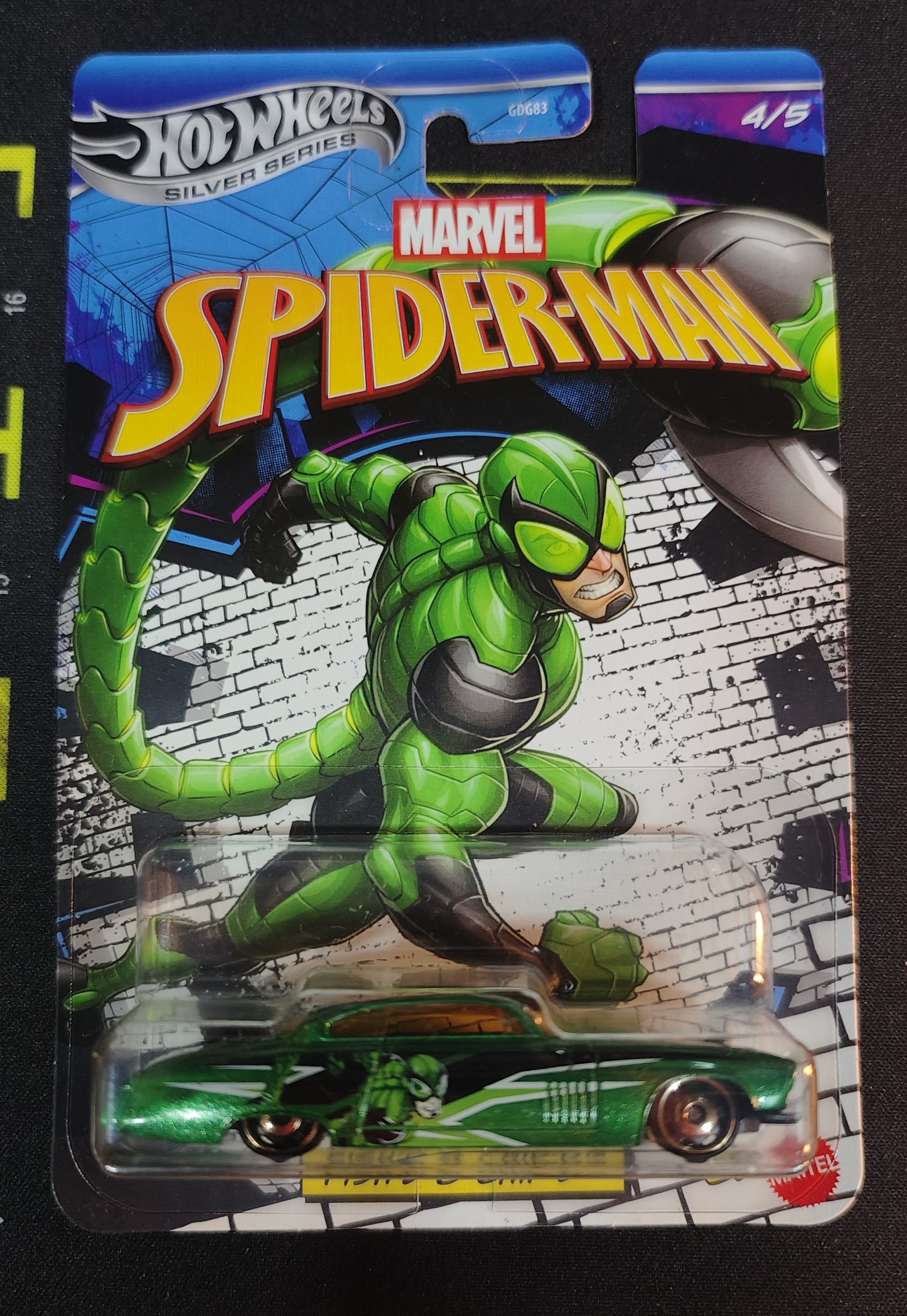 Hot Wheels Marvel Spider-Man action figure in packaging with superhero design.