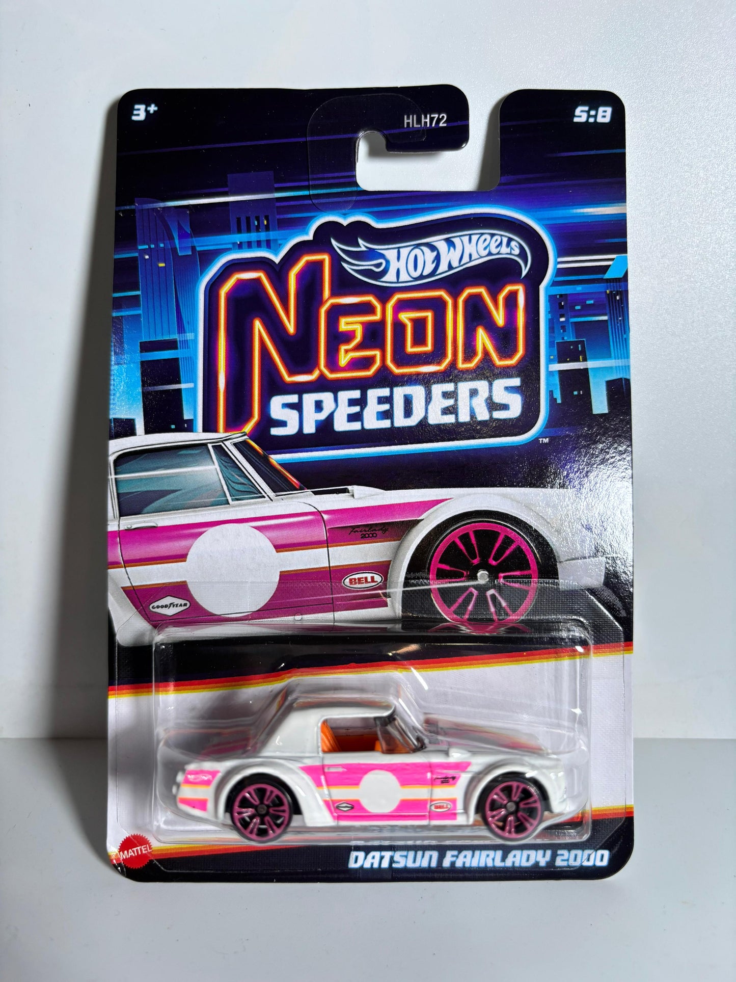 Hot Wheels Neon Speeders Datsun Fairlady 2000 toy car in packaging on a gray background