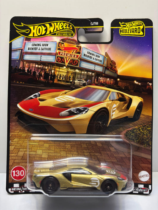 Hot Wheels car in packaging with a movie theater background