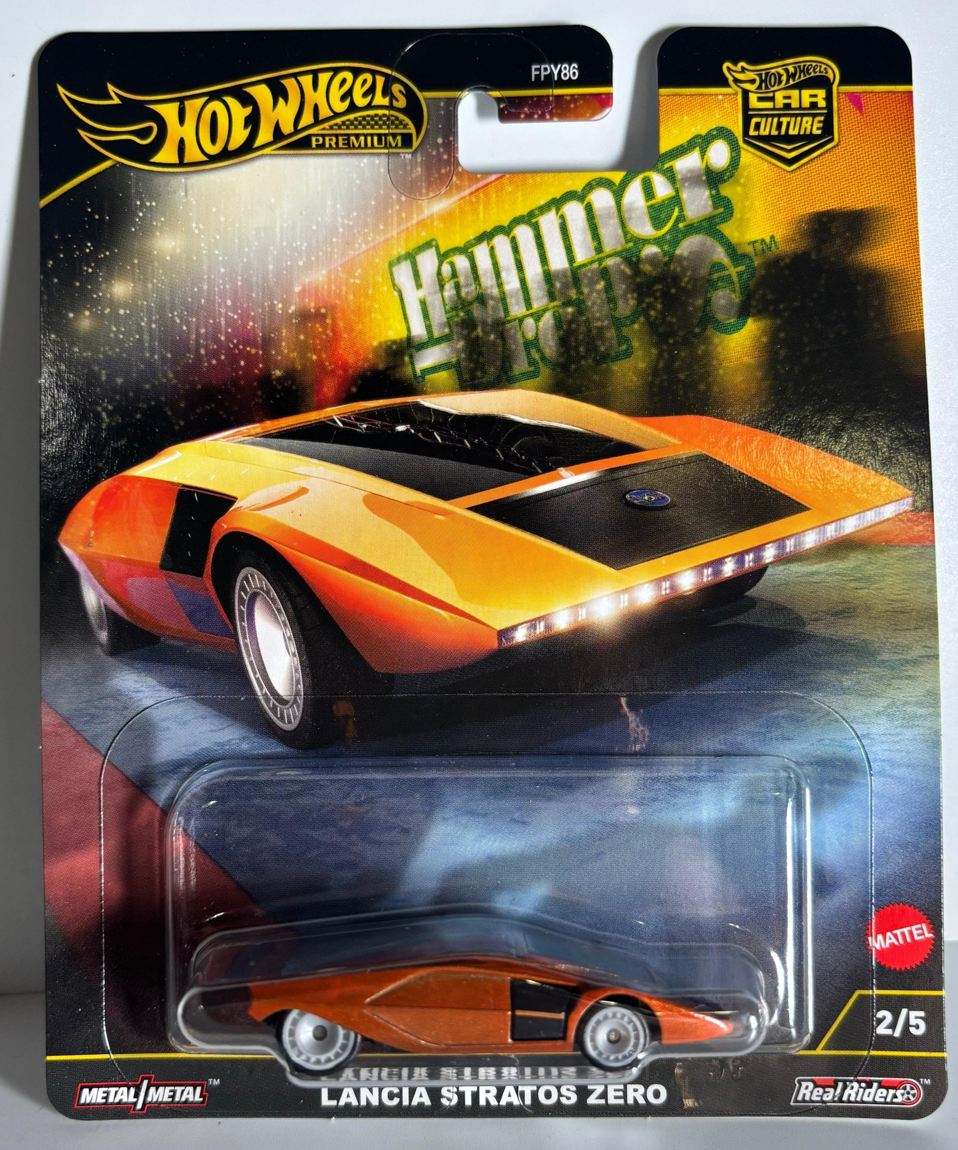 Hot Wheels Lancia Stratos Zero toy car in packaging on a gray background