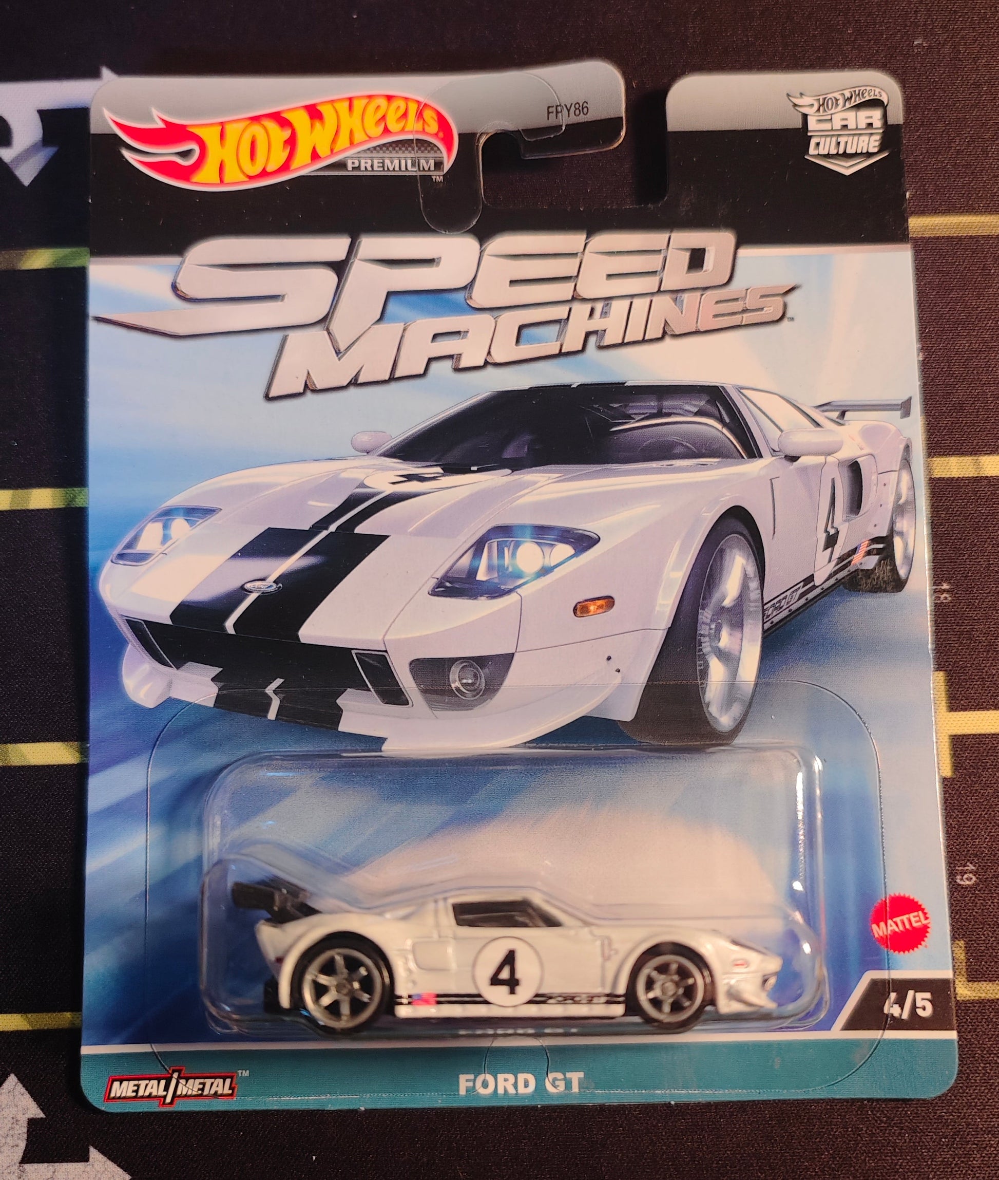 Hot Wheels Speed Machines Ford GT toy car in packaging on a black surface