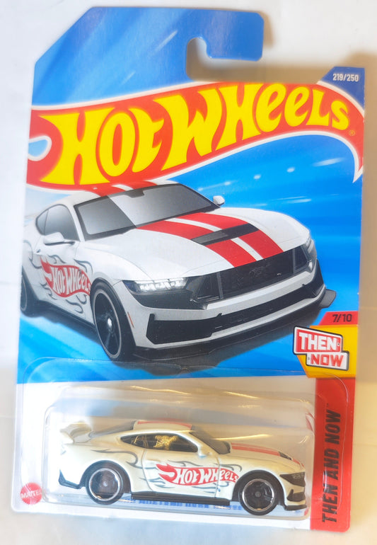 Hot Wheels Ford Mustang Dark Horse toy car packaging with a white car on a blue background Front Pack