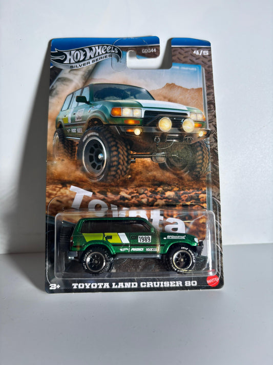 Hot Wheels Toyota Land Cruiser 80 toy car in packaging on a gray background