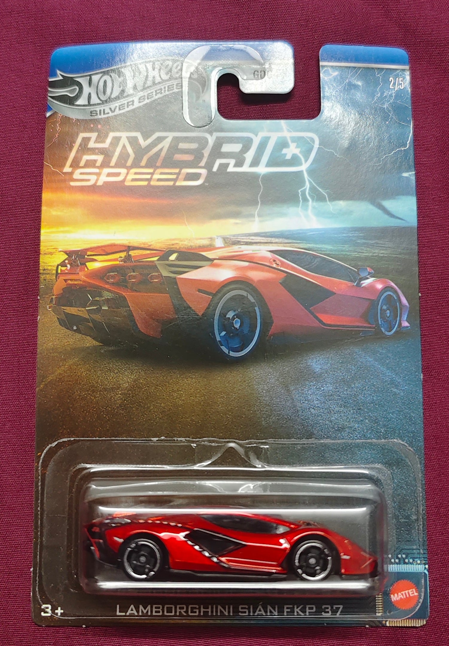 Hot Wheels Lamborghini Huracan Performante toy car in packaging on a maroon background