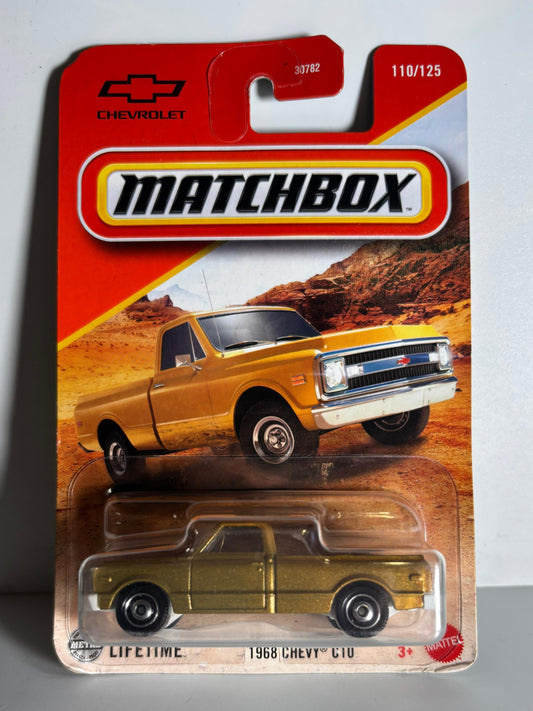Matchbox toy truck packaging with a yellow truck on a desert background
