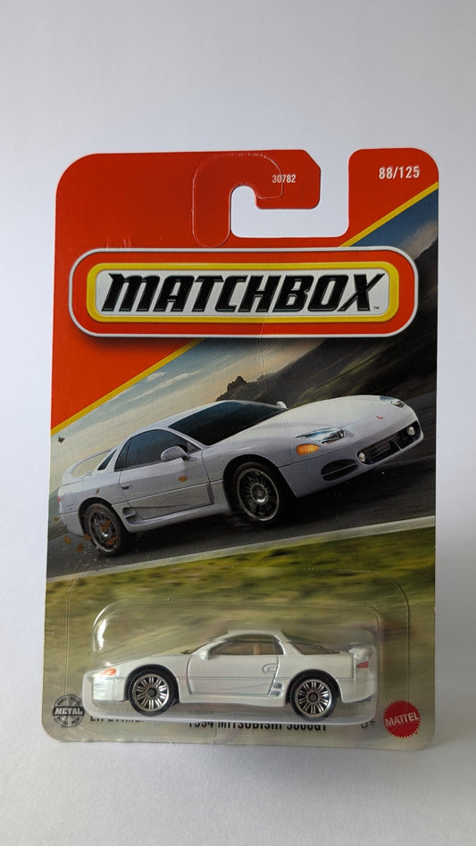 Matchbox toy car packaging with a white sports car on a gray background