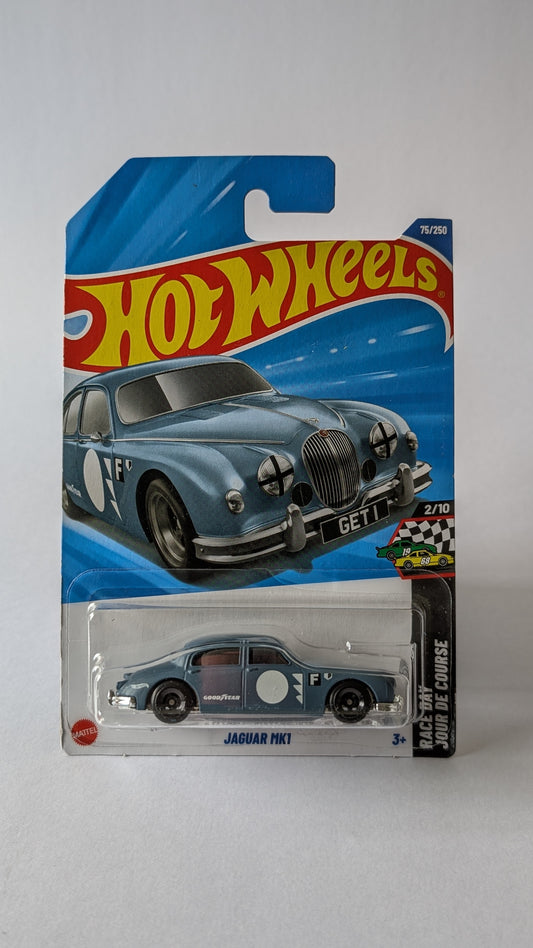 Hot Wheels Jaguar car in packaging on a gray background