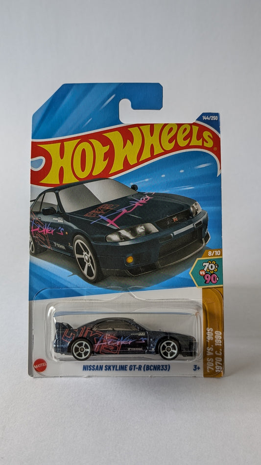 Hot Wheels Nissan Skyline GT-R (BNR33) toy car in packaging on a gray background