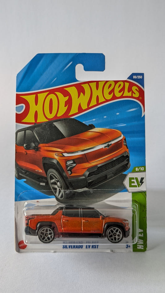 Hot Wheels toy car in packaging with orange Chevrolet Silverado EV RS3 on a white background